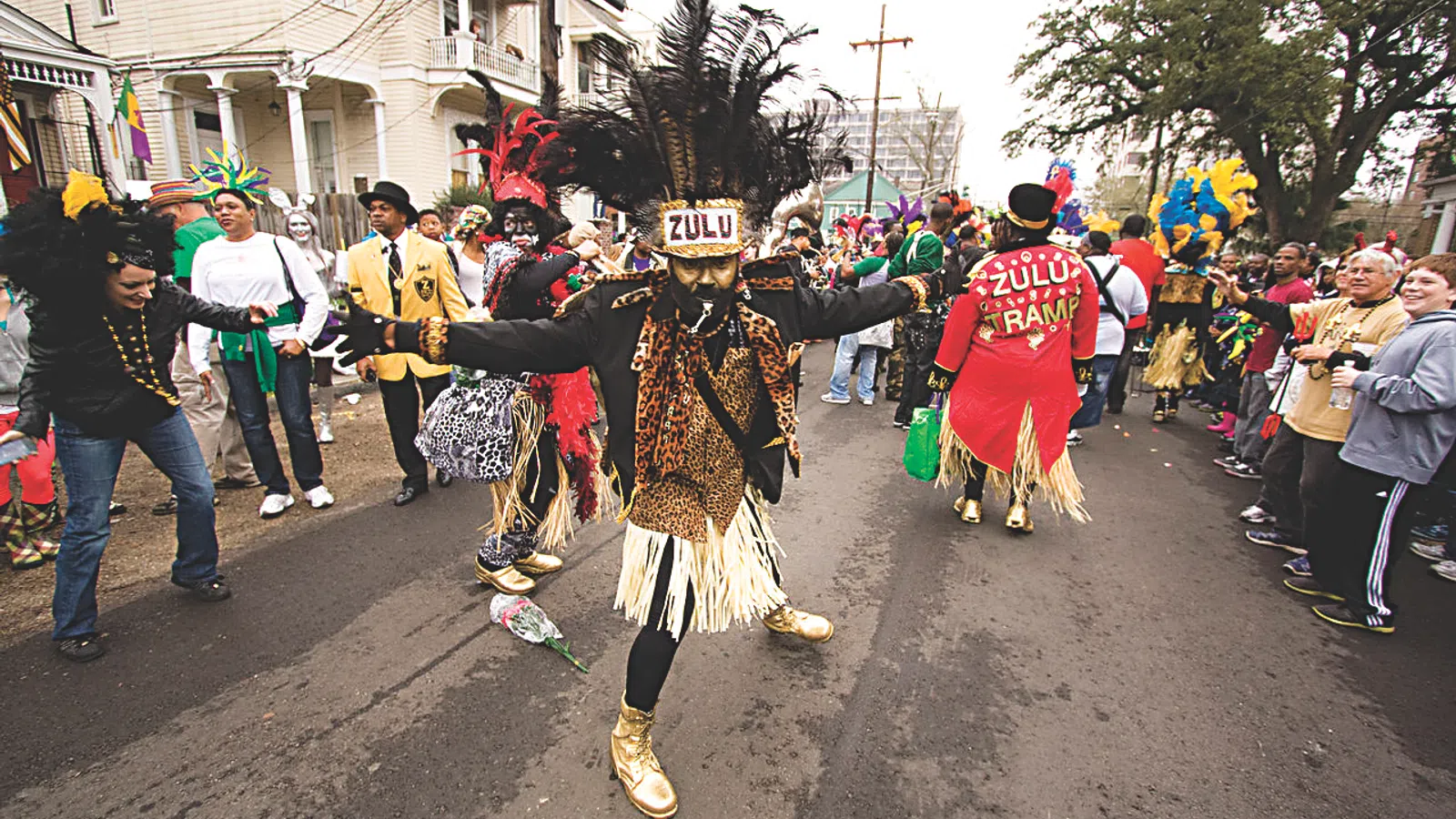 a person in a garment dancing in a parade
