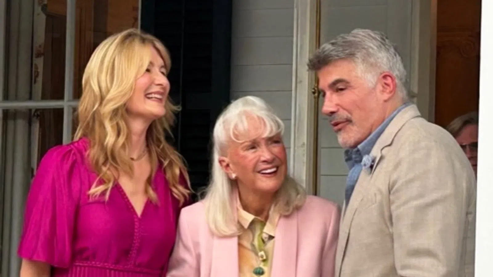Bryan Batt et al. standing together smiling