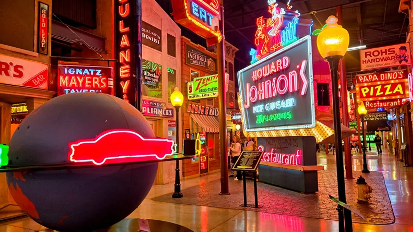 Colorful neon signs inside a retro diner-style atmosphere creating a vibrant ambiance.
