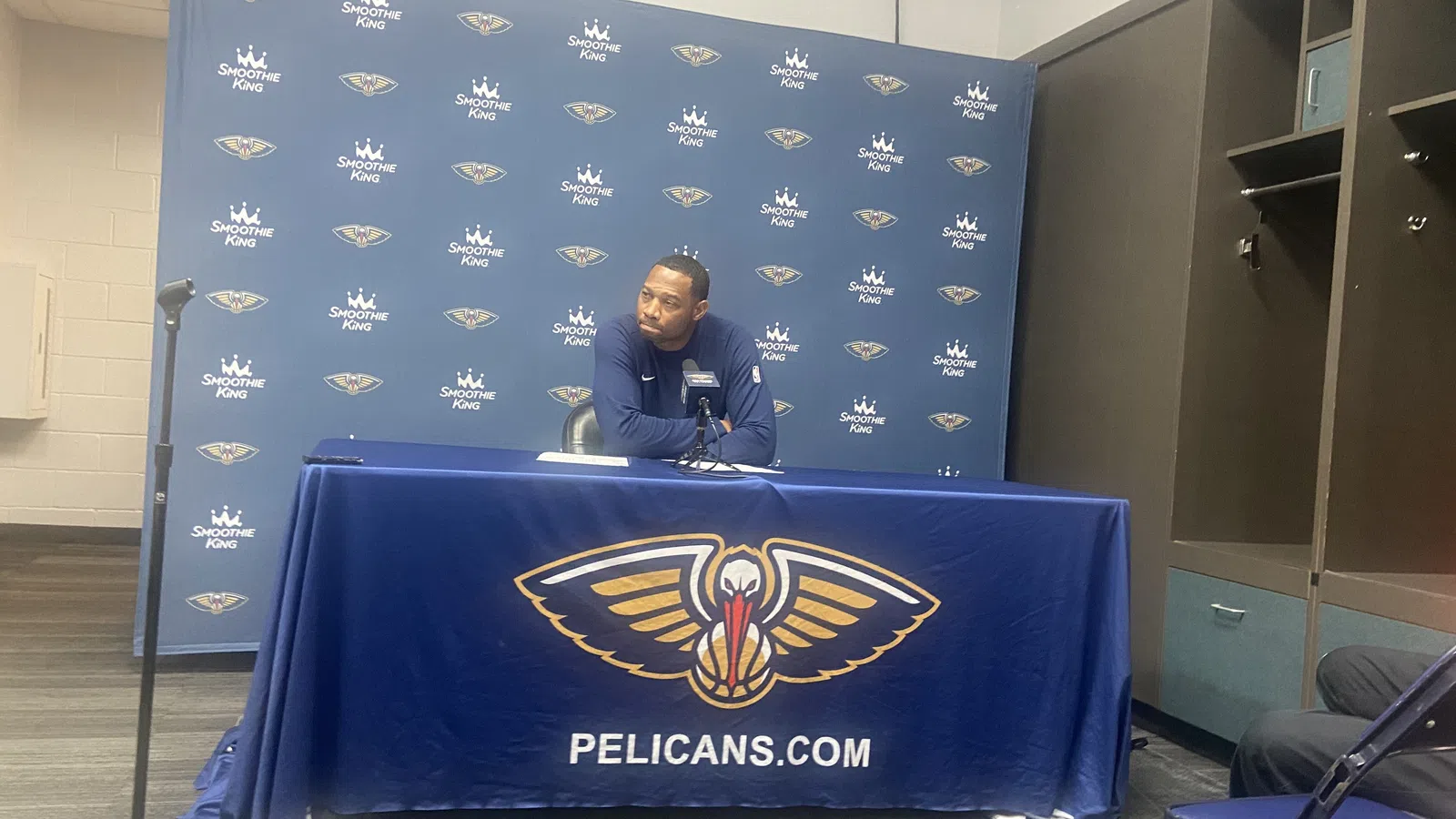 a person sitting at a podium