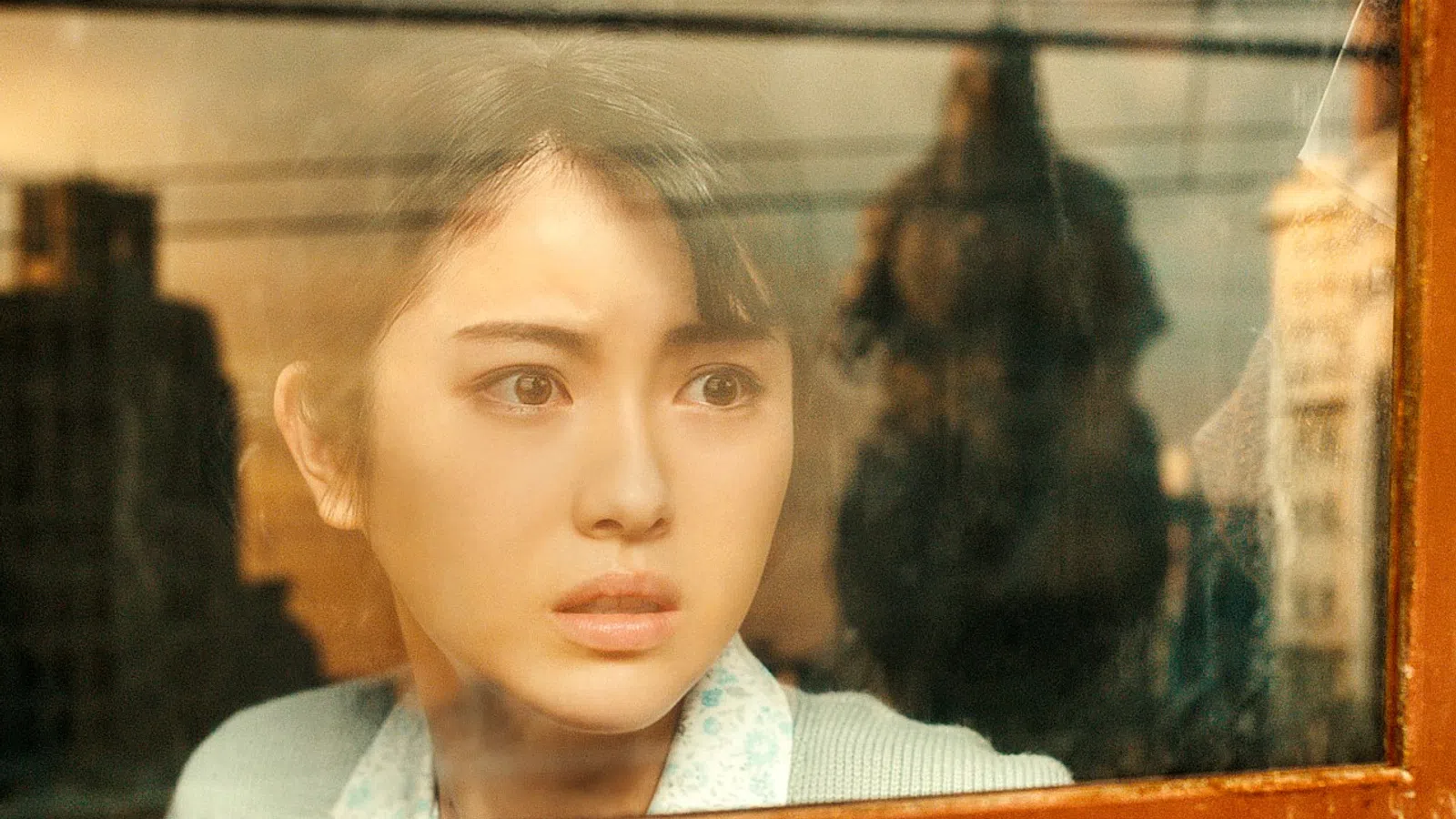 a woman looking at the camera