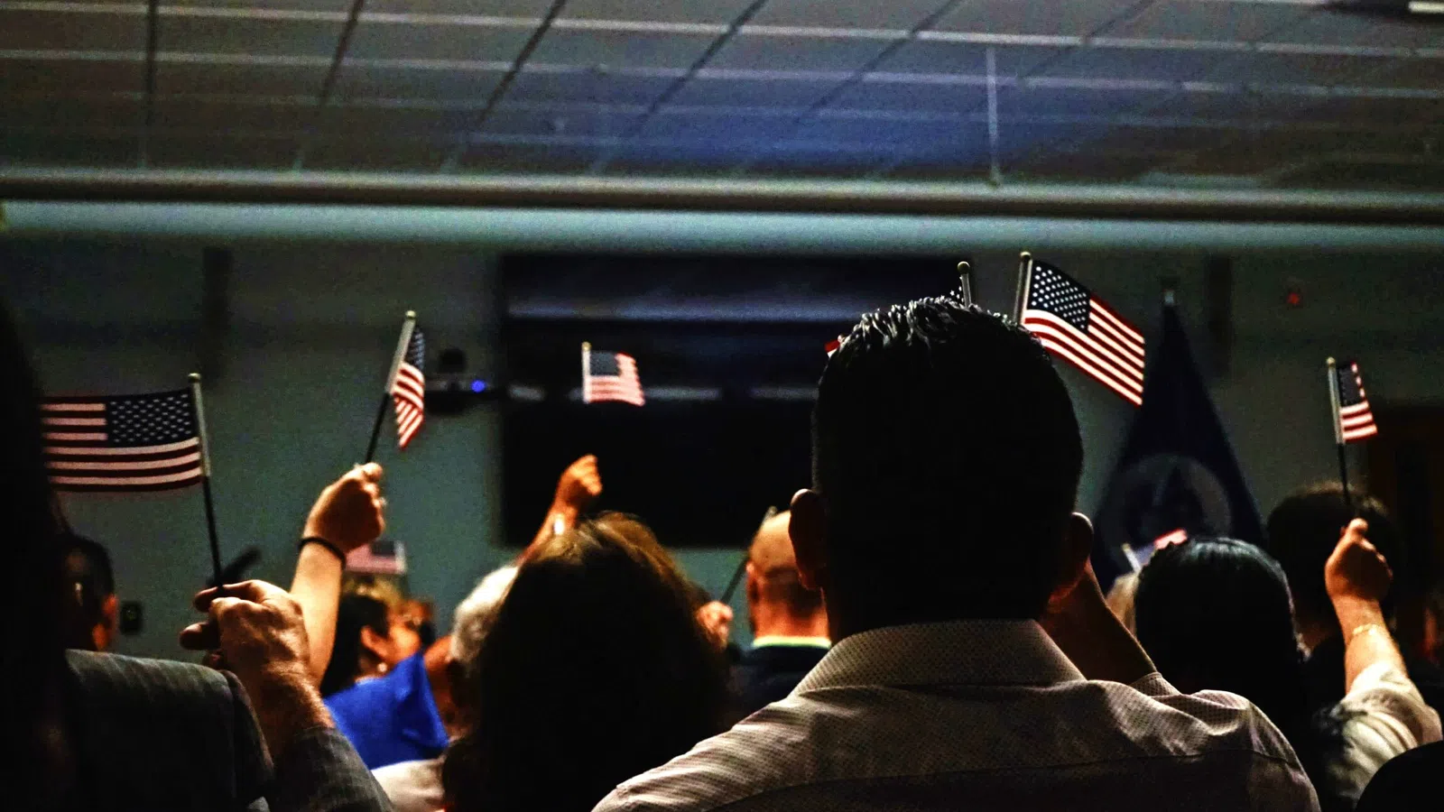 a group of people holding flags