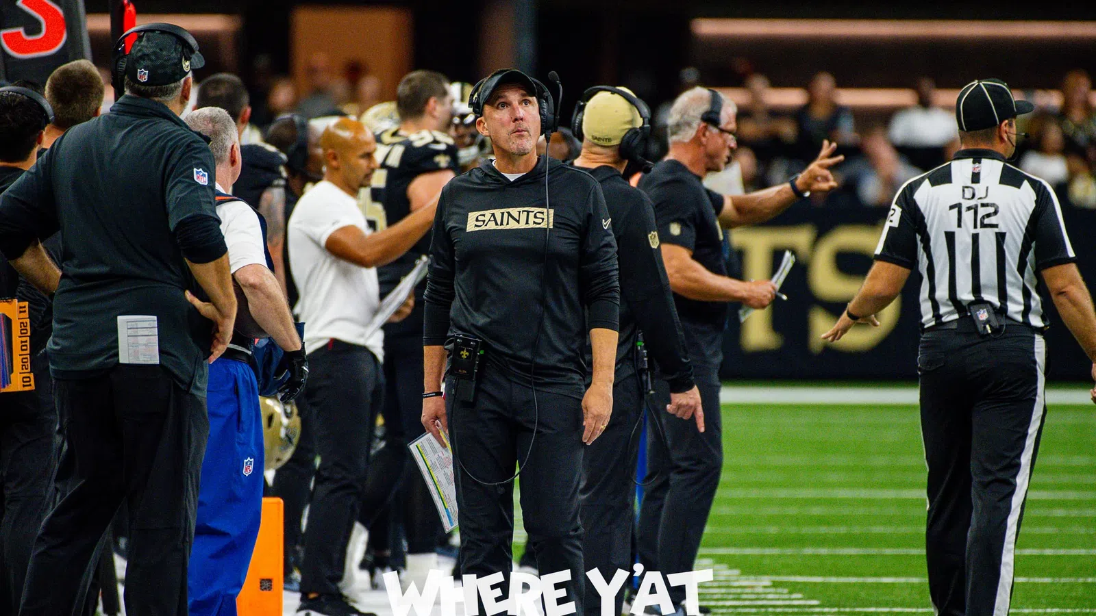 a football coach talking to his team