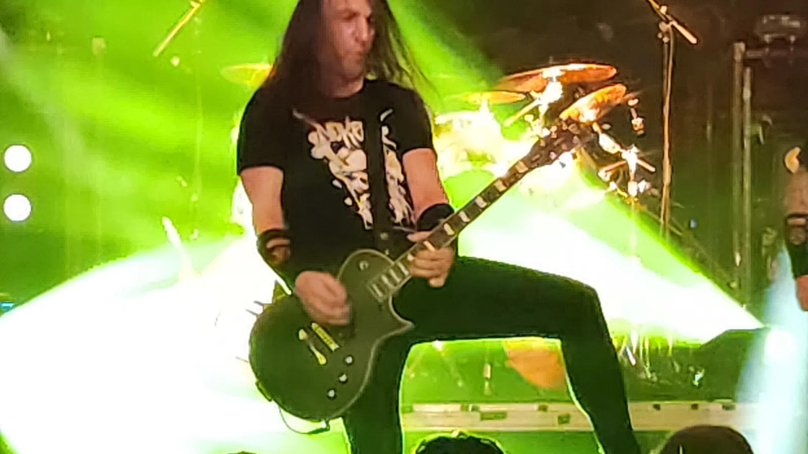a person playing a guitar on a stage