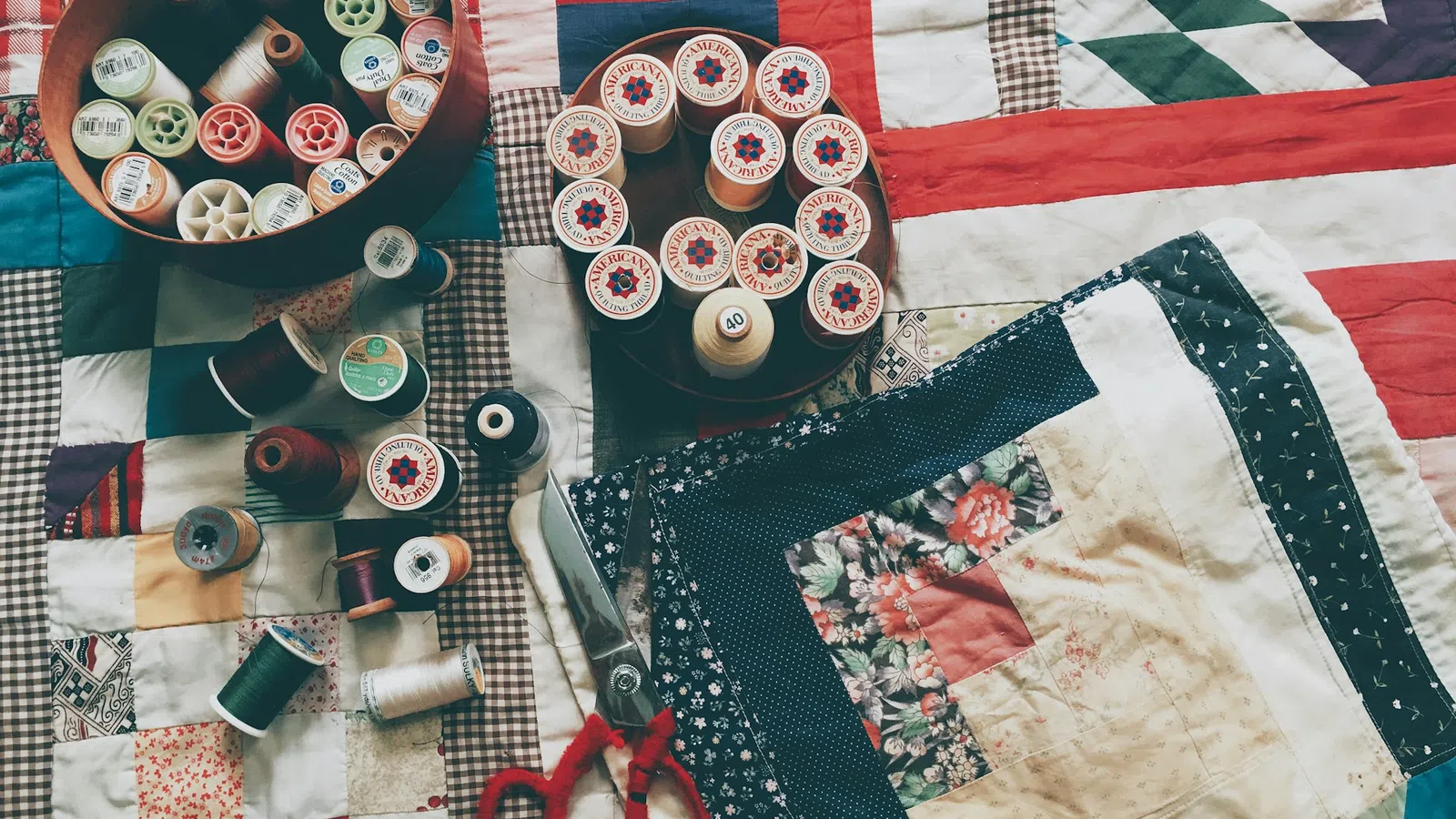 a table is filled with sewing supplies