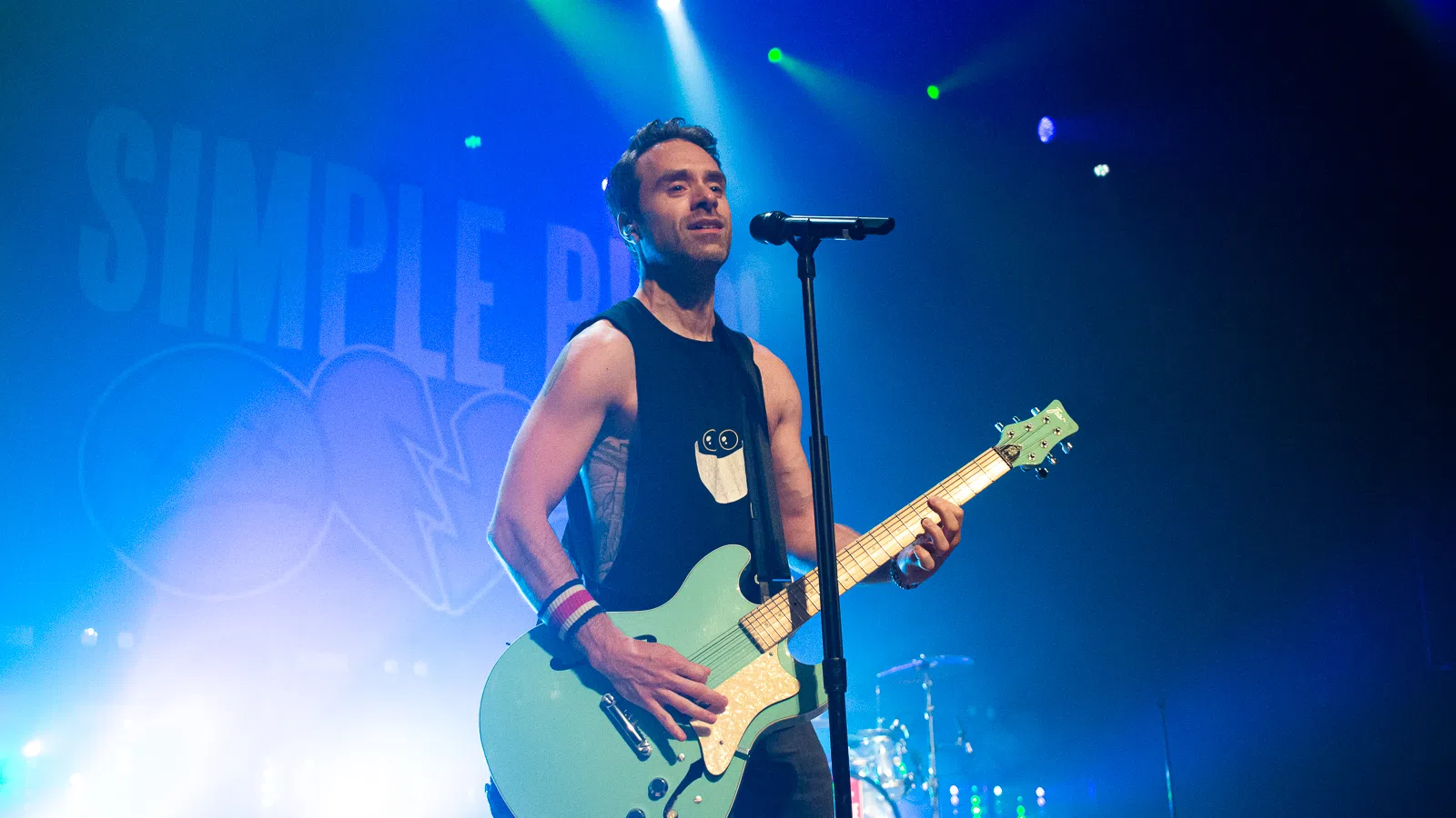 Sebastien Lefebvre playing a guitar on a stage