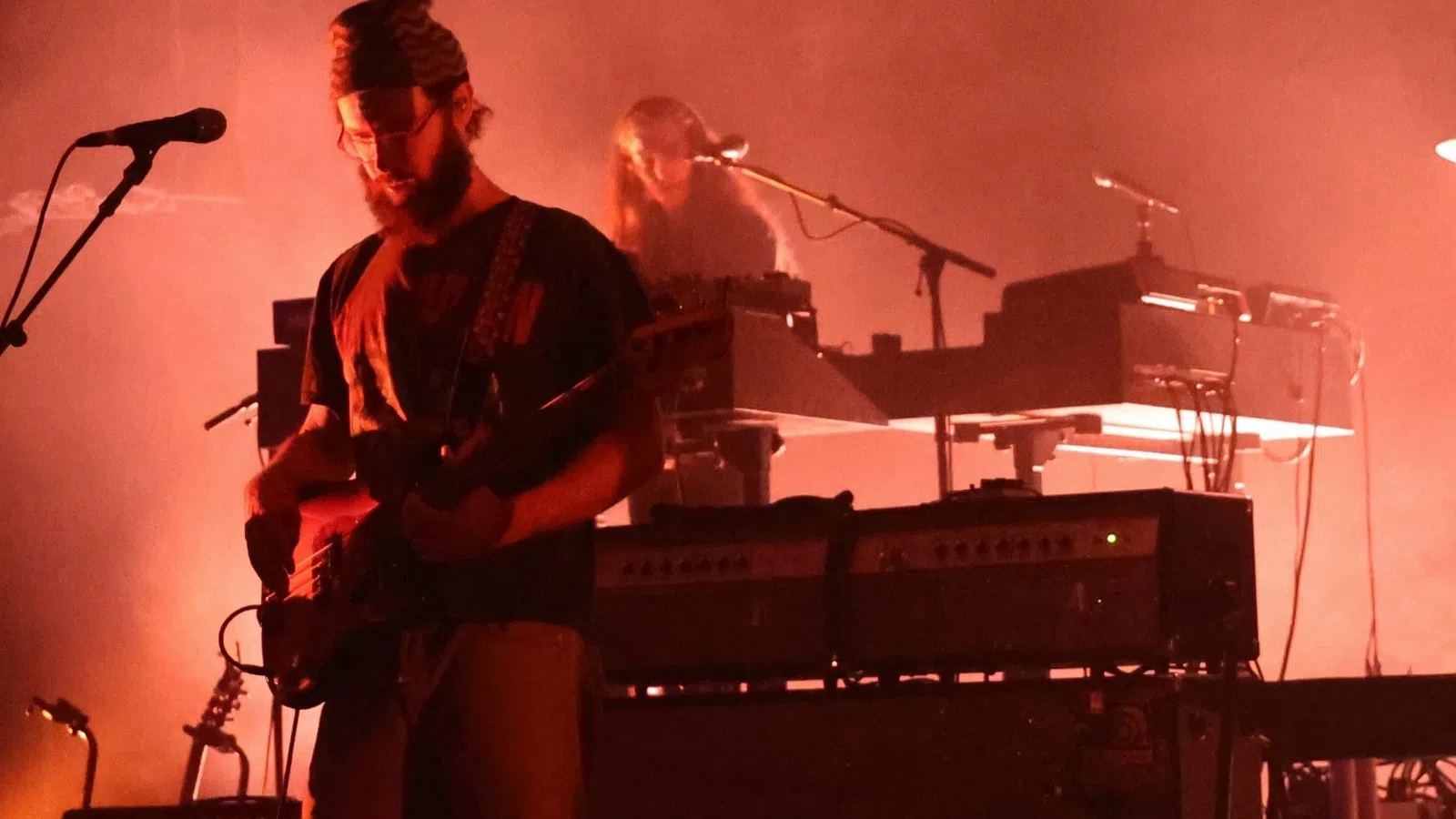 a man playing a keyboard on a stage