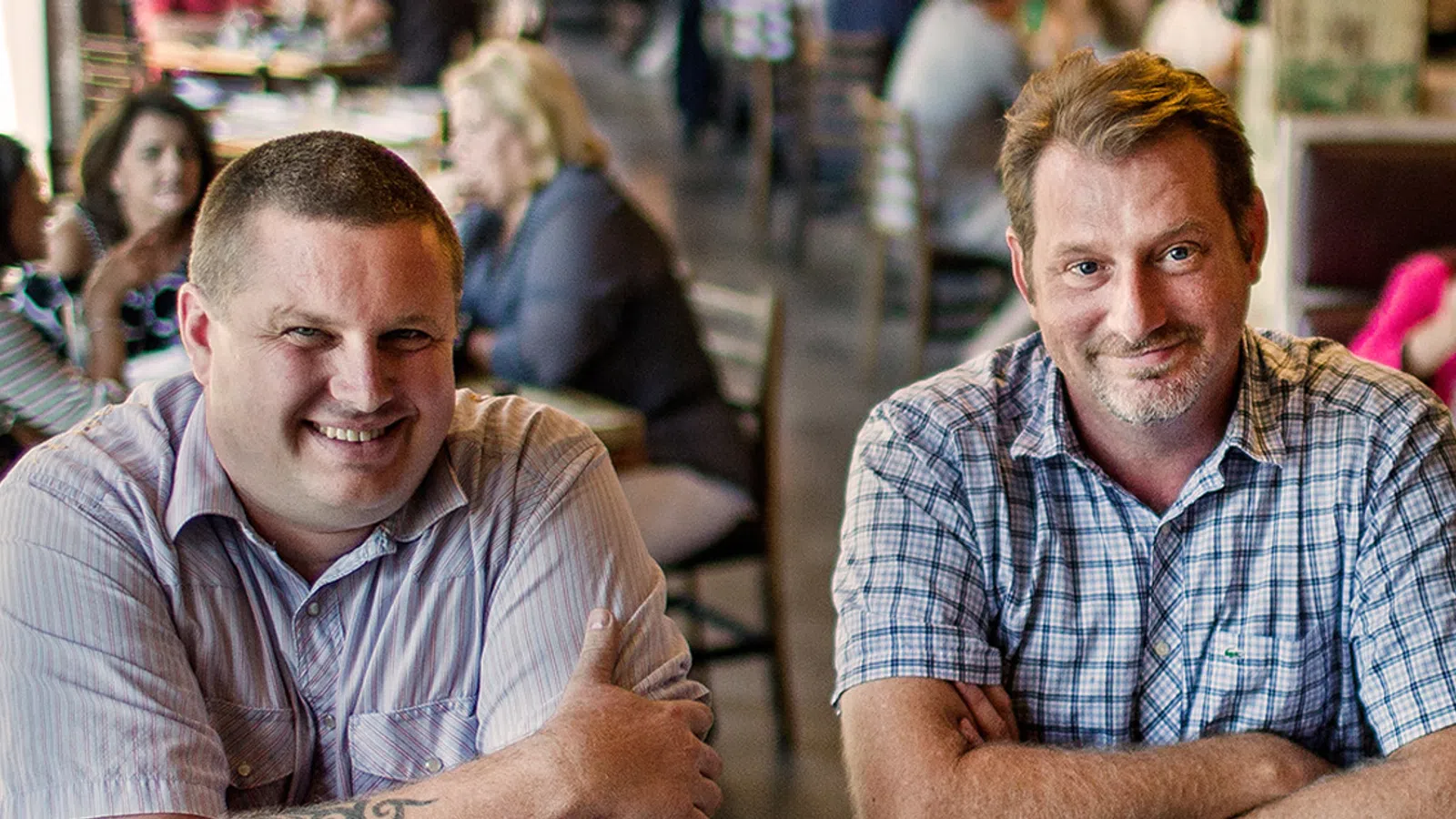 two men sitting together