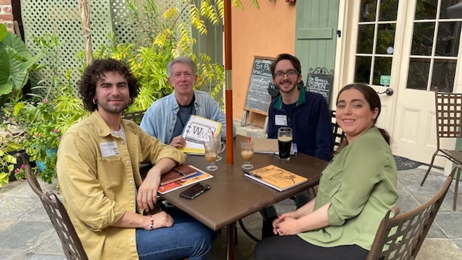 a group of people sitting around a table