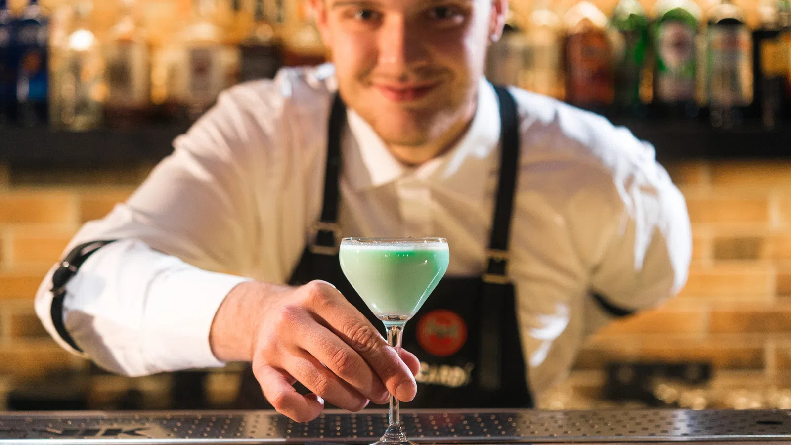 a man holding a drink