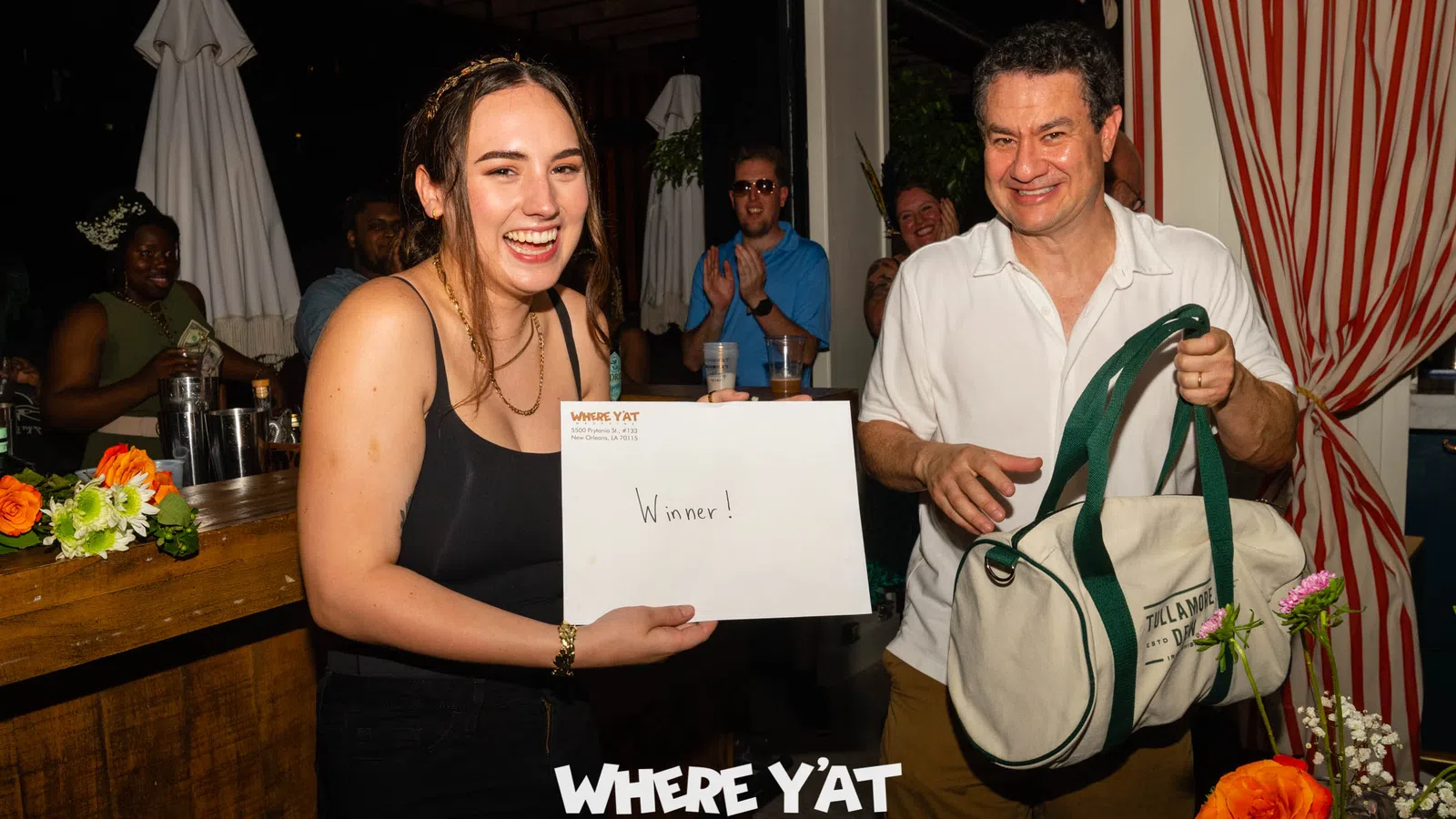 a man and woman holding a certificate
