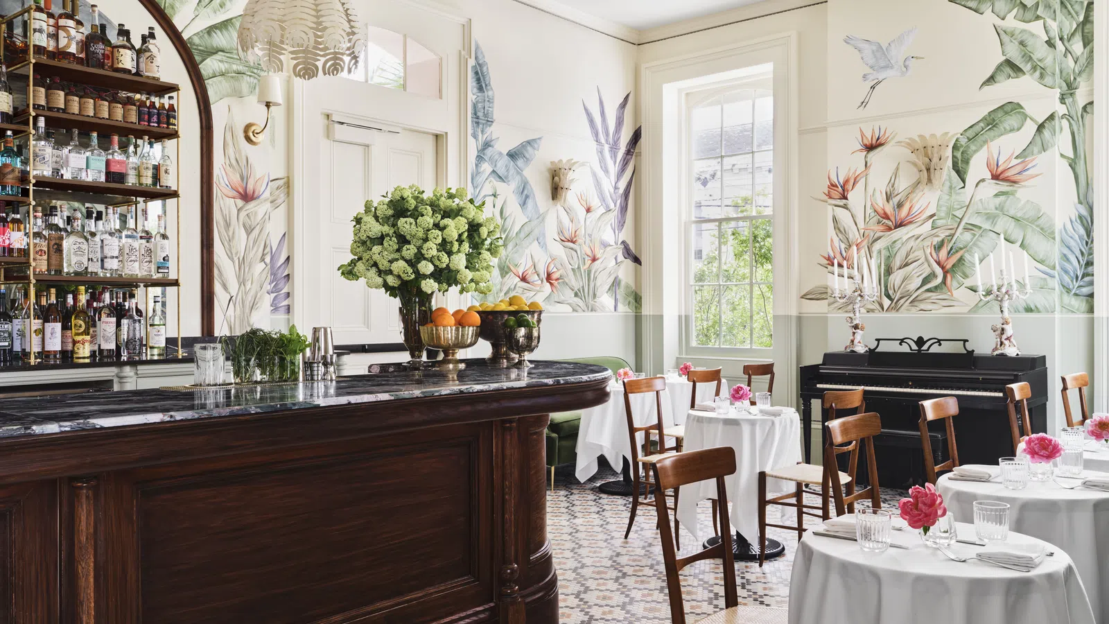 a room filled with furniture and a large window