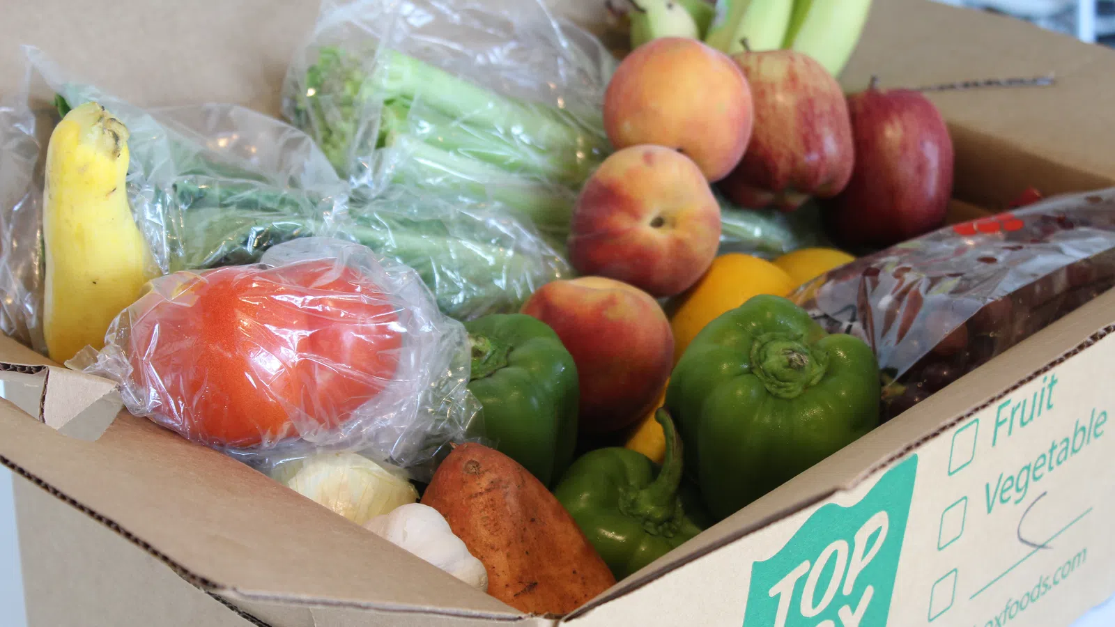 a box of fruit and vegetables on display