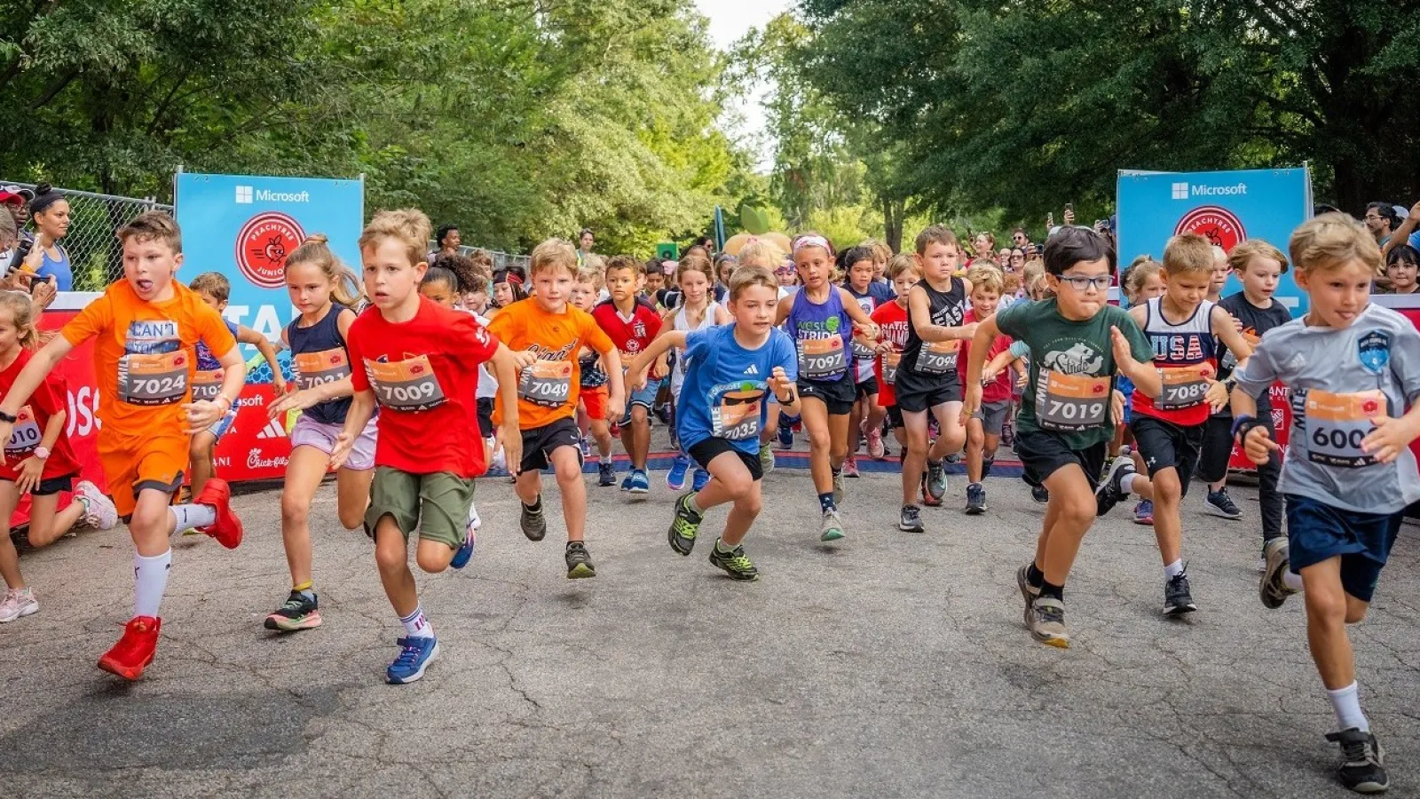 a group of people running on a road