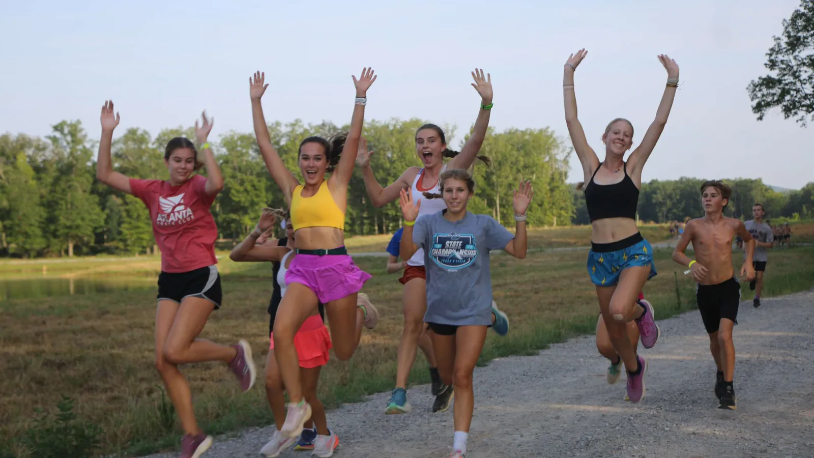 a group of people jumping in the air