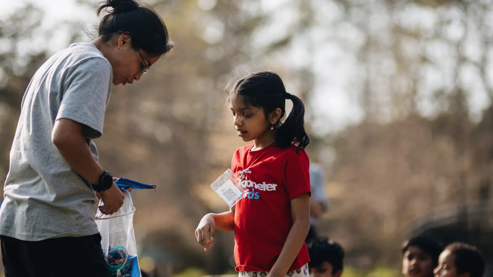 a woman instructing a female child