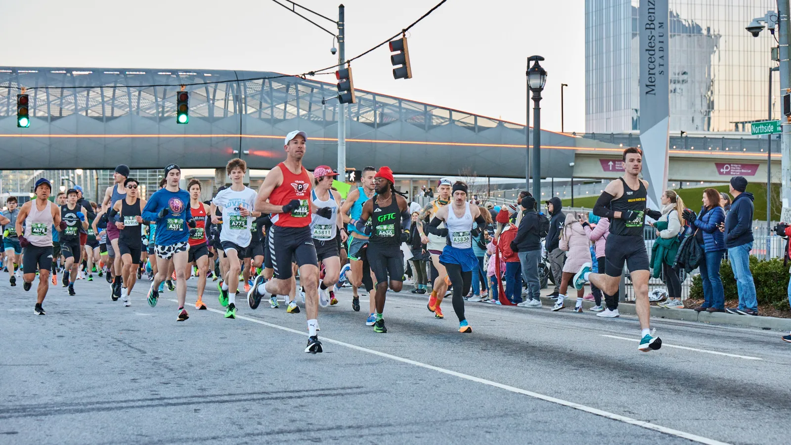 a group of people running on a street