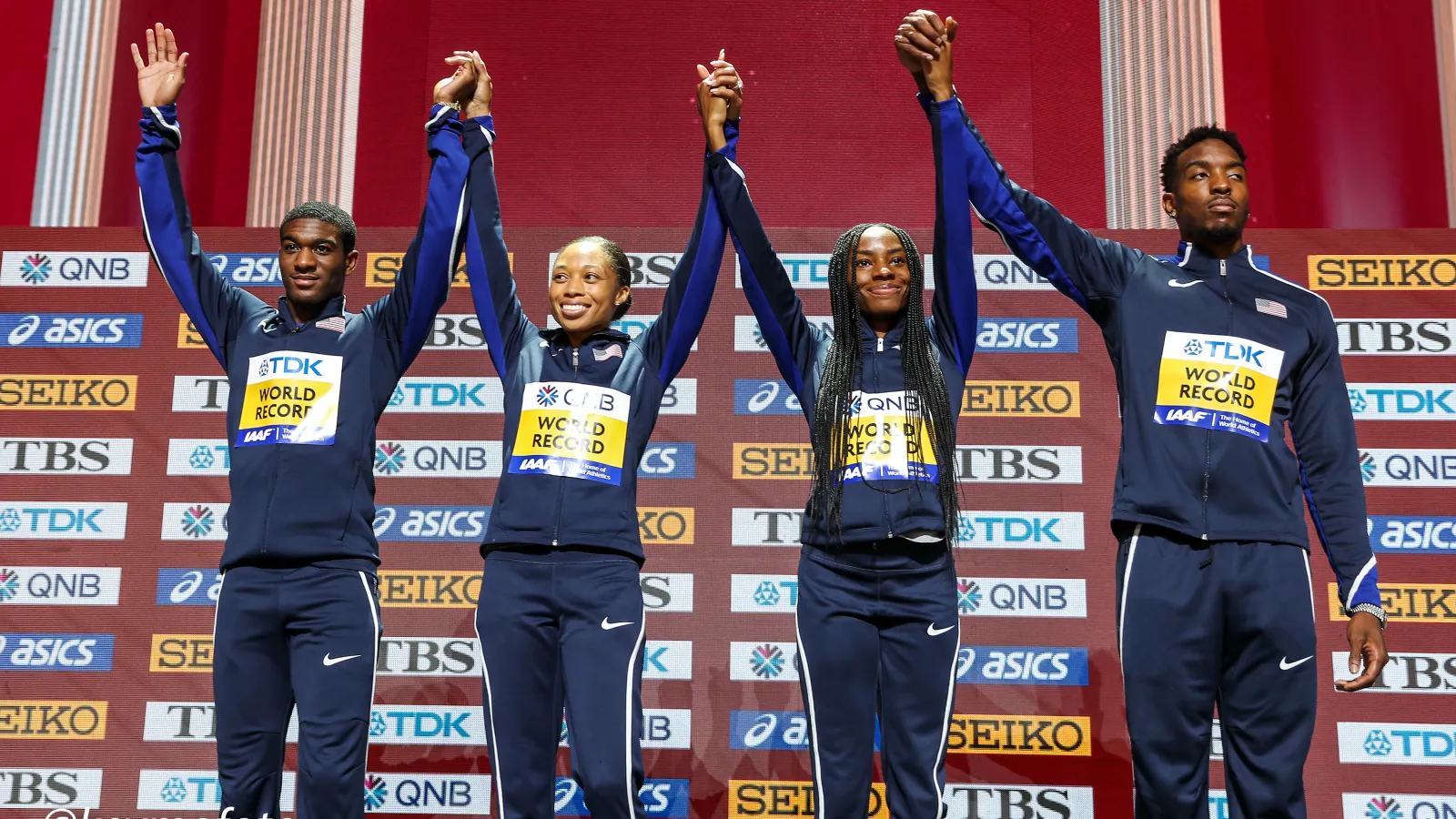 Allyson Felix et al. posing for a photo