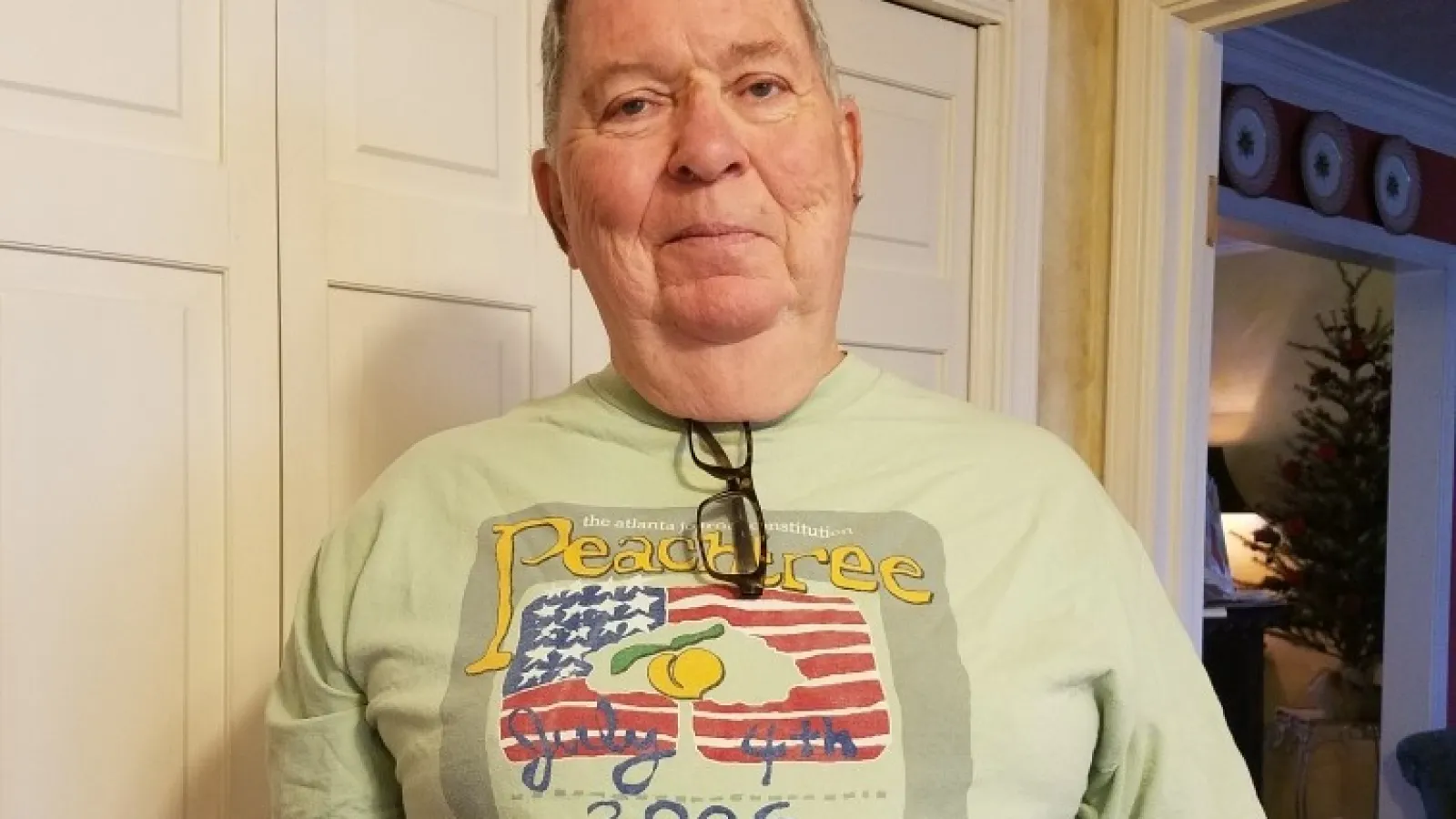 Ed Madden wearing the 2006 AJC Peachtree Road Race finisher's shirt
