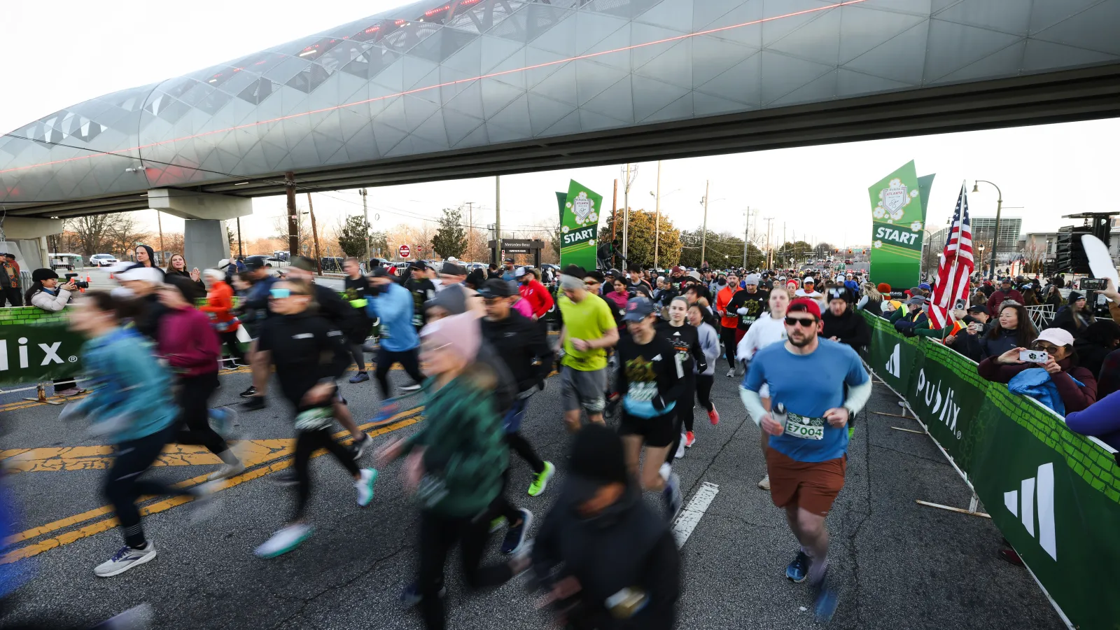 a group of people running on a street
