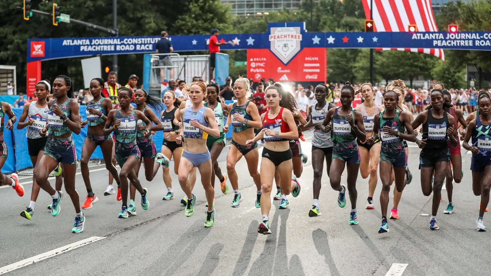 a group of people running on a street