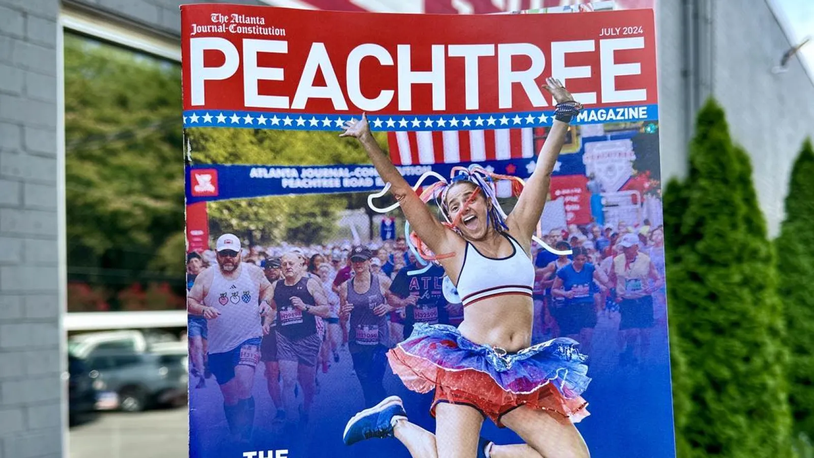 a hand holding a sign