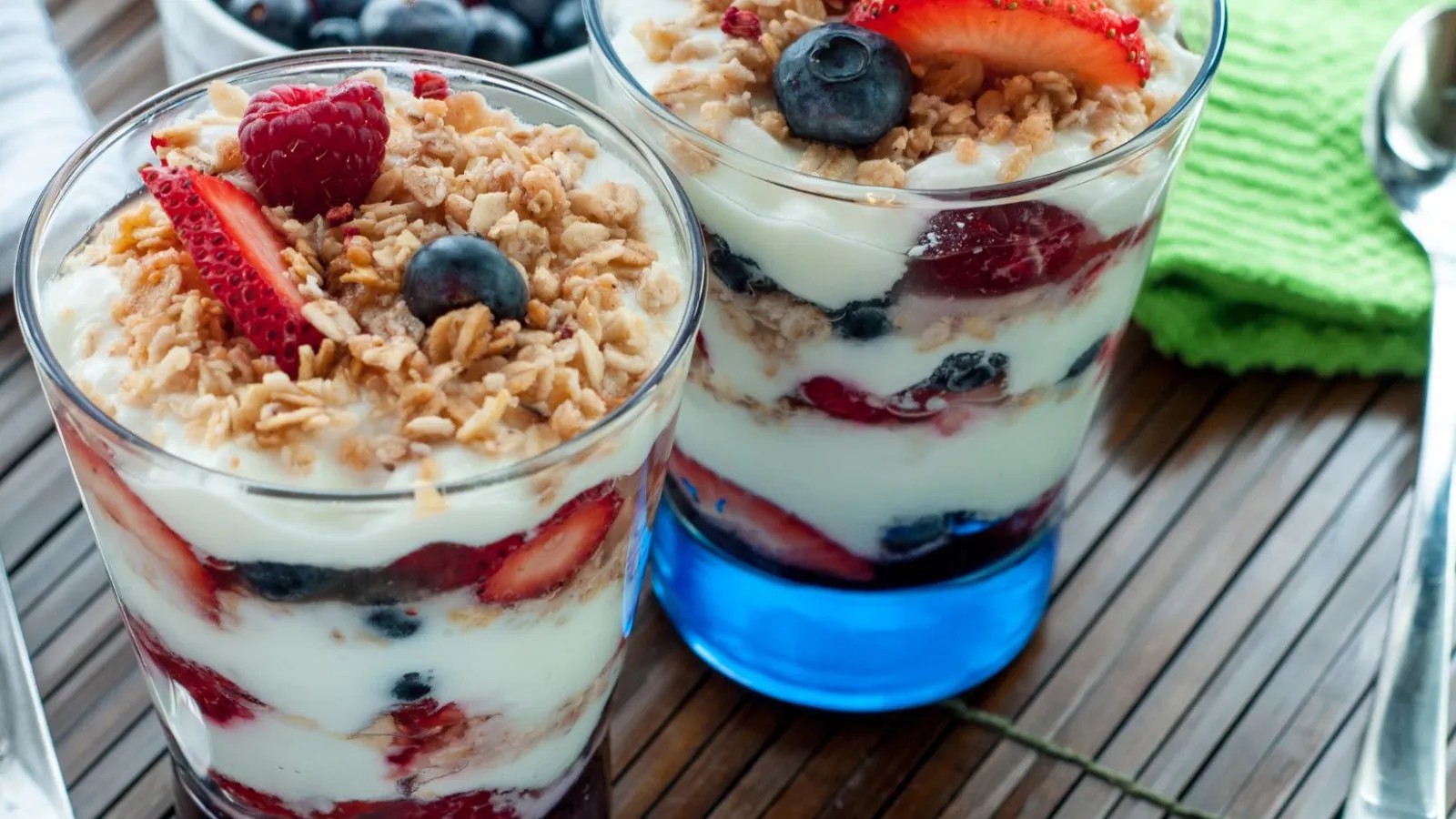 a group of glasses with fruit in them