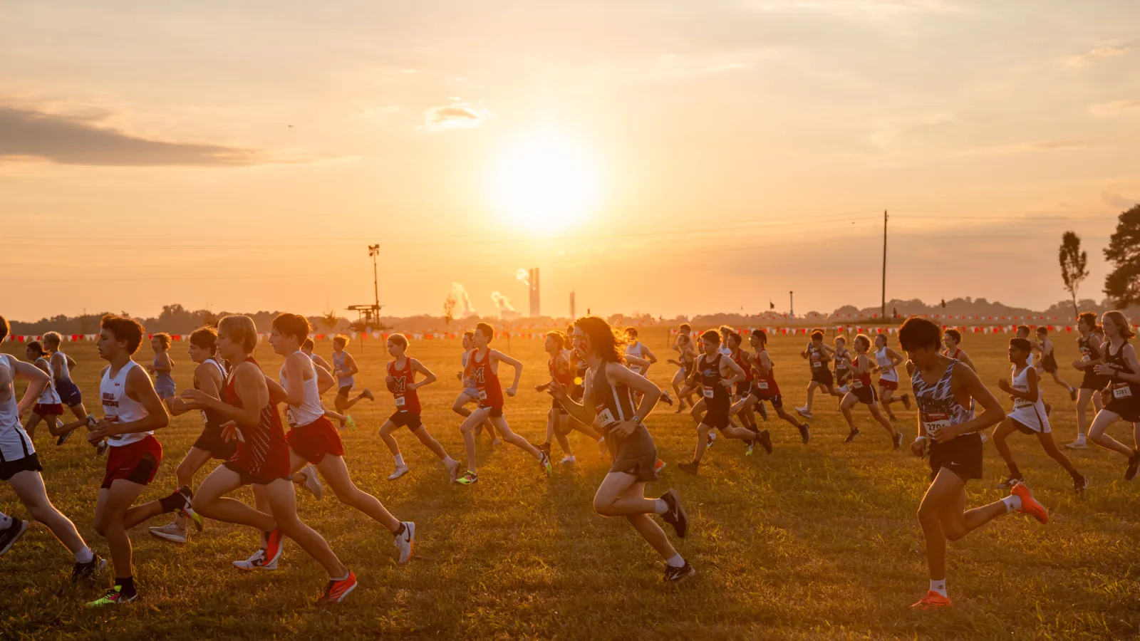 a group of people running on a field