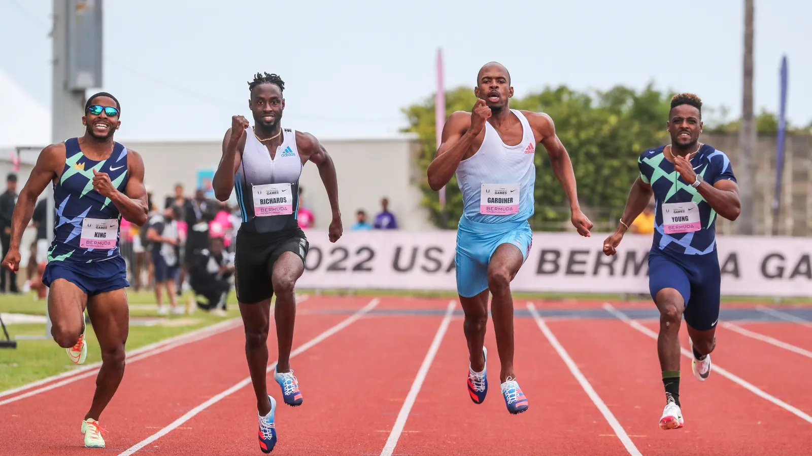 a group of men running on a track