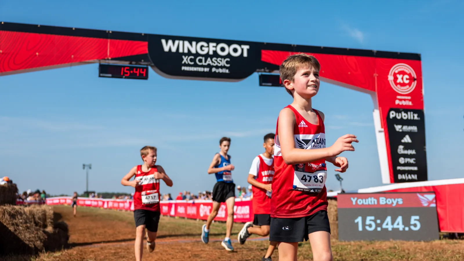 a group of people running on a track