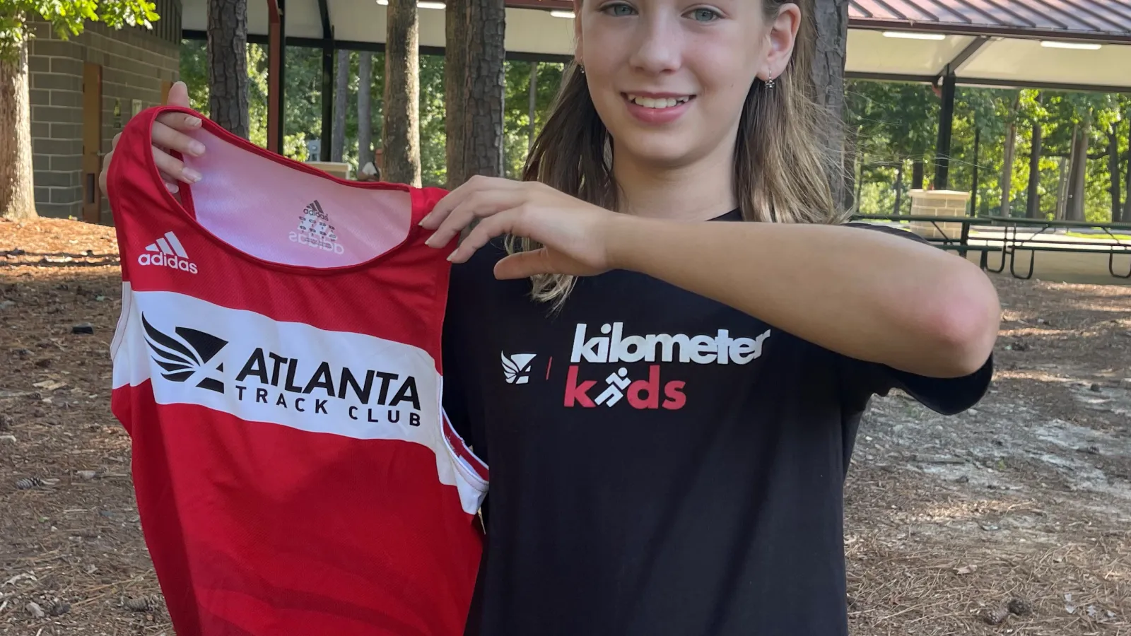 a girl holding a shirt