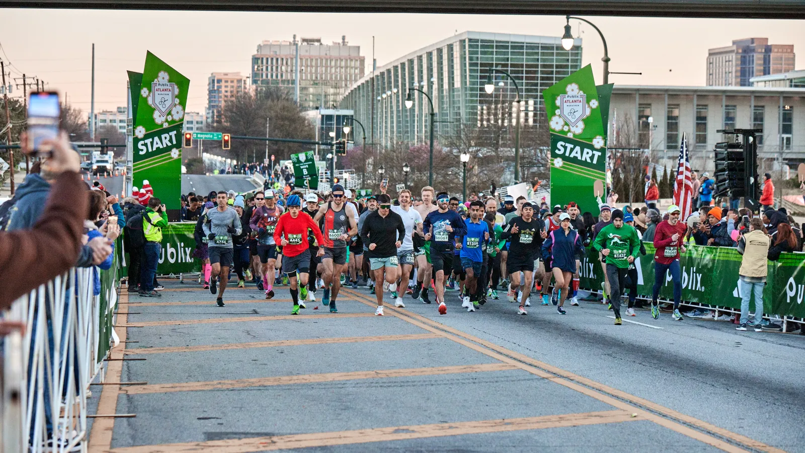 a group of people running on a street