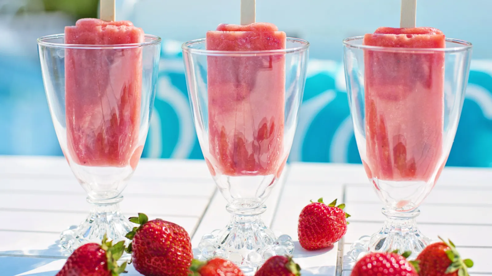 a group of glasses with strawberries