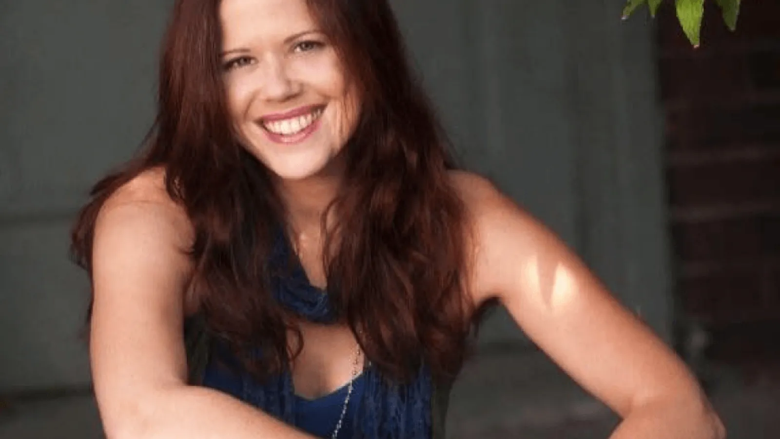 Julie Gribble with long hair smiling