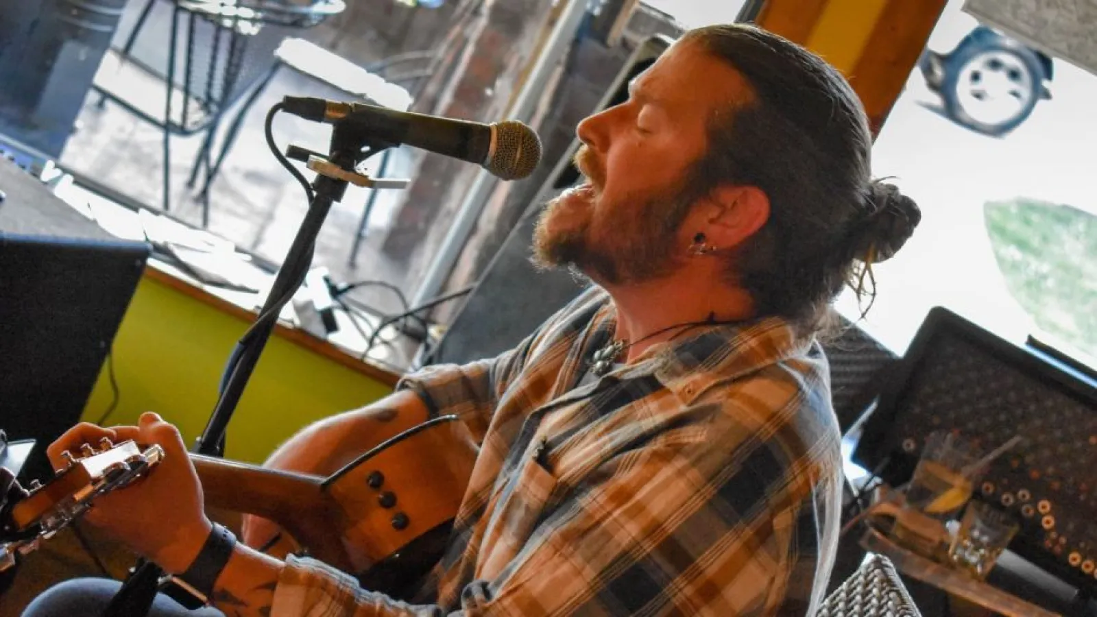 a person standing in front of a television