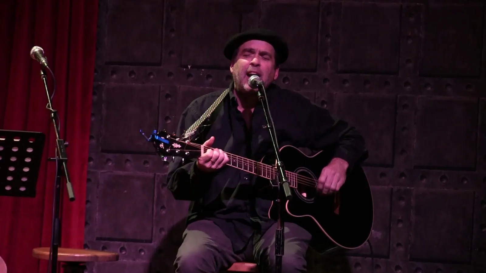 Greg Benson singing with guitar