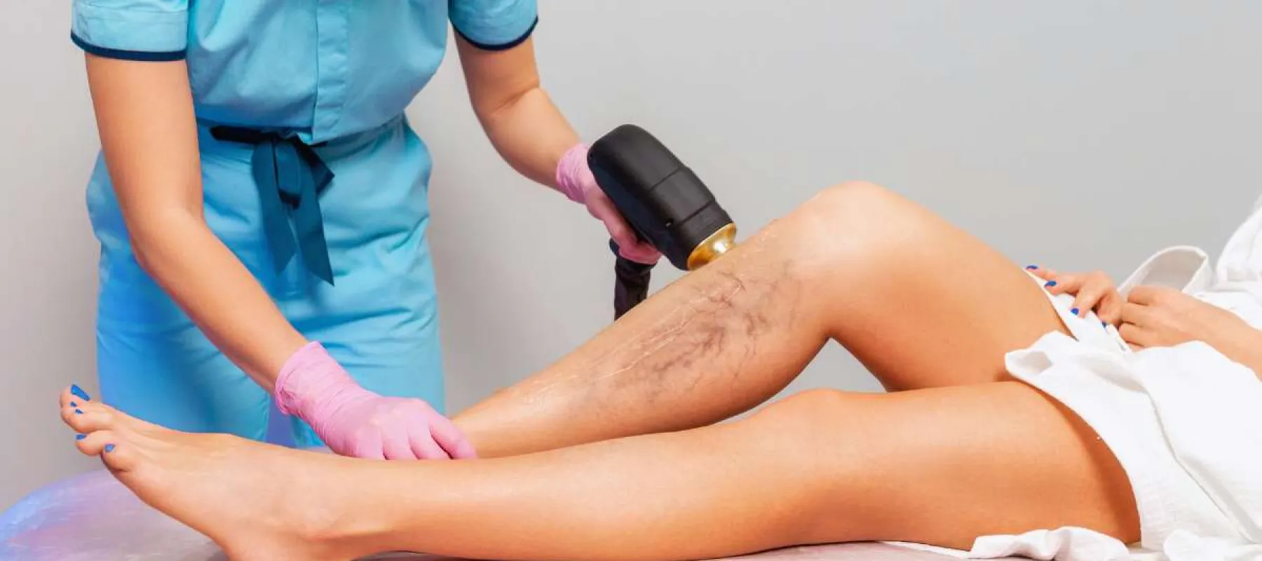 Technician performs laser hair removal on a woman's legs, targeting coarse hair on one leg and smooth skin on the other.