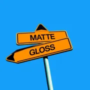 Orange signs with black text that say Matte and Gloss