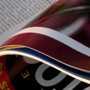 A booklet with a gloss cover and pages