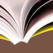 Close-up of an open softcover book bound with PUR adhesive