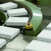 Stacks of cut paper sheets moving along a conveyor