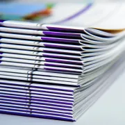 A stack of custom printed booklets