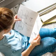 A woman reading an Instruction Manual