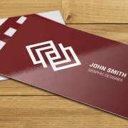 A printed business card with a glossy finish