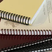 Four Spiral Bound books in a stack