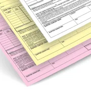 A 3-part NCR form with white, yellow, and pink ply sheets