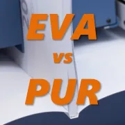The pages of a book being glued within a cover with EVA or PUR glue