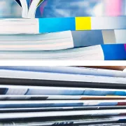 A stack of Perfect Bound books and a stack of Saddle Stitched books