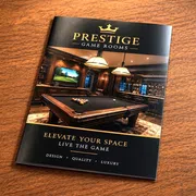 A luxury game room brochure displaying a high-end pool table in an elegant game room setting.