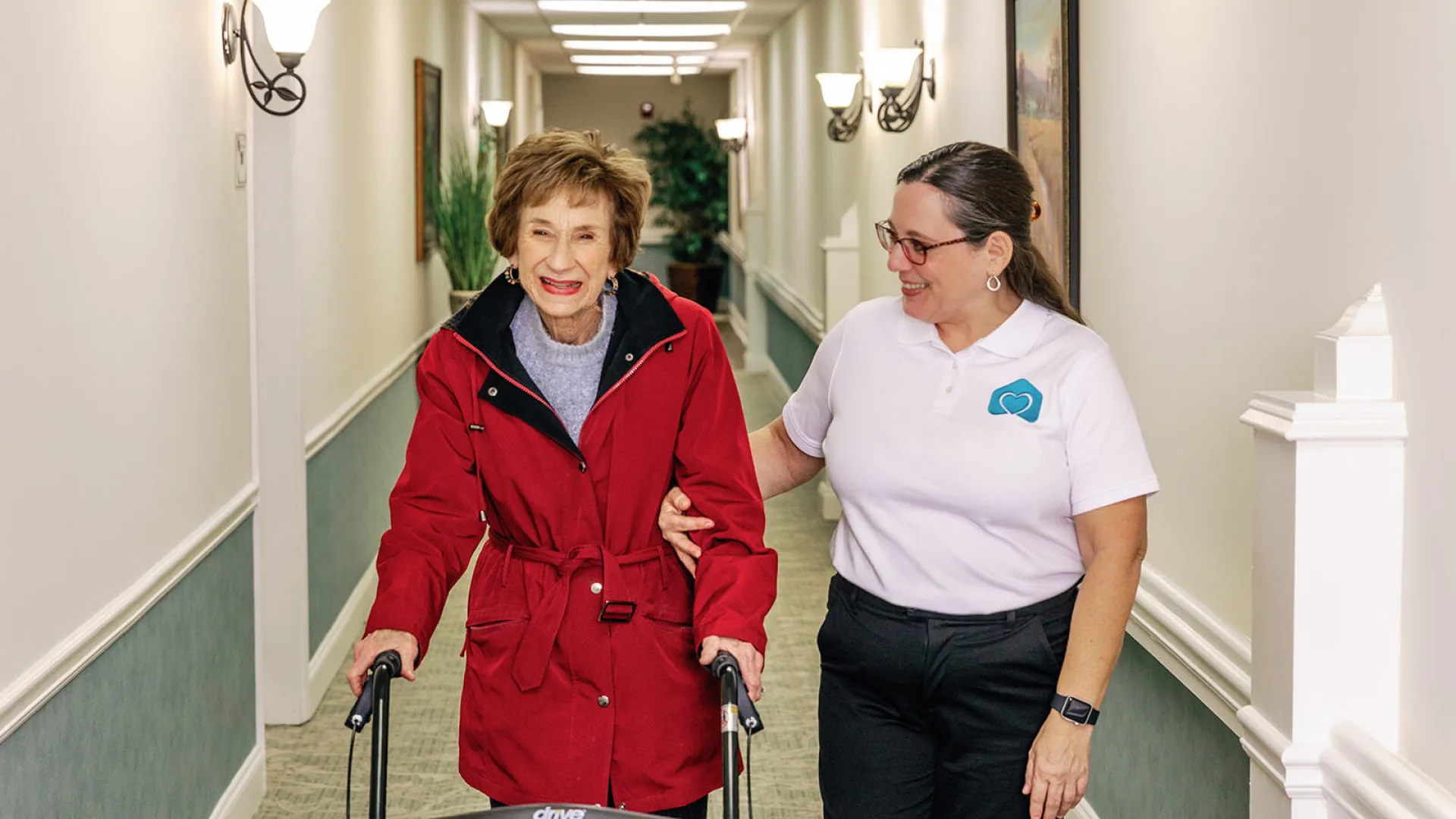 a person and a person walking down a sidewalk